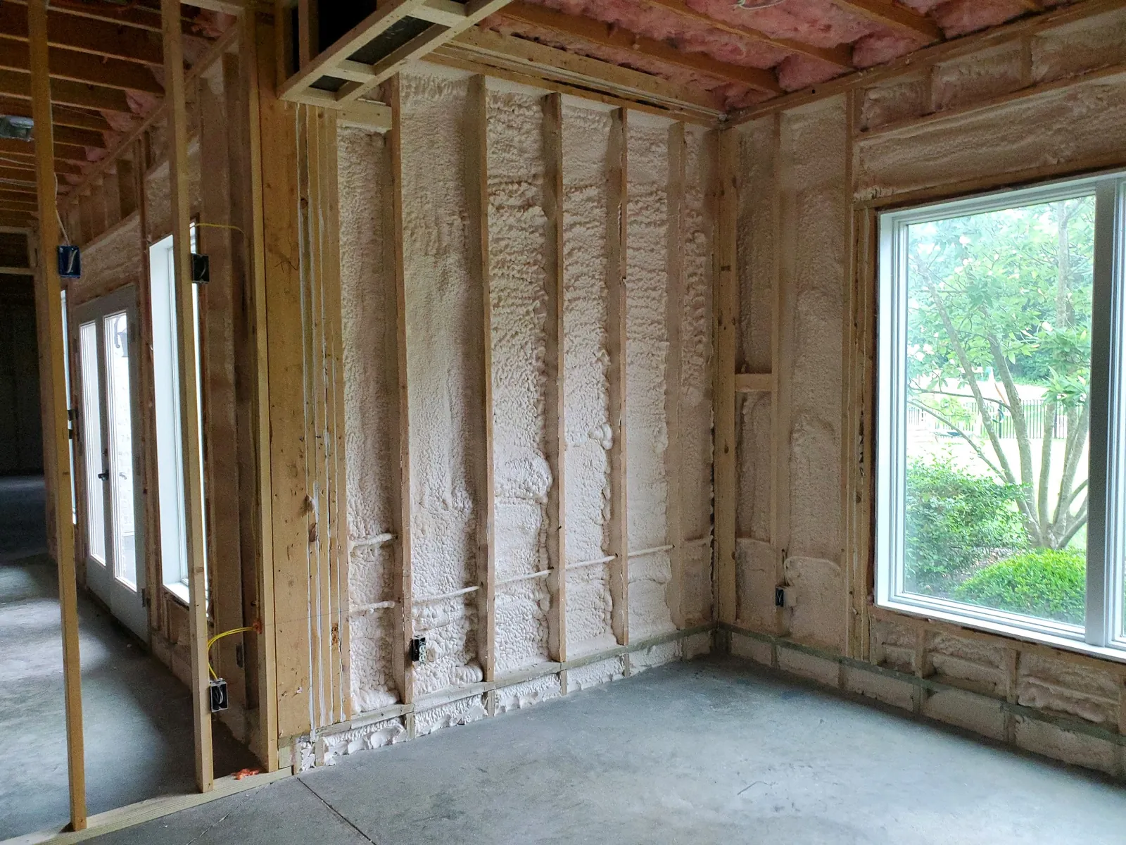 Spray foam insulation applied in a wall cavity